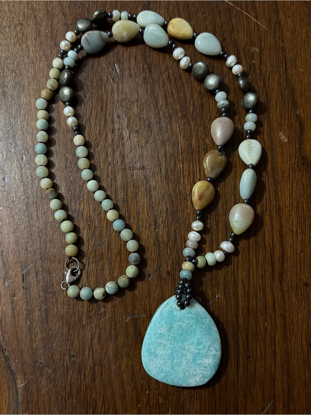 Rare Gemstone with Sterling silver accents on 18” Tear drop necklace